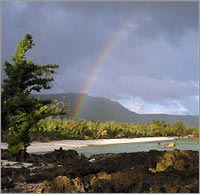 A rainbow graces the lush vegetation covering the Marianas