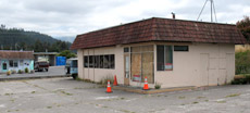 photo of a boarded up service station