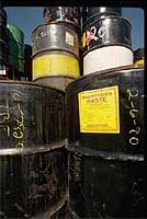 Photo of stacked waste drums
