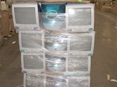 This stack of once-useful, now discarded computers and monitors was sloppily shrink-wrapped together then shipped overseas without permits, where they were rejected by local customs officials.