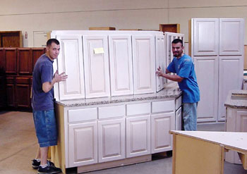Workers moving cabinets