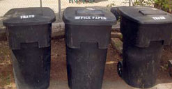 A picture of three recycling bins