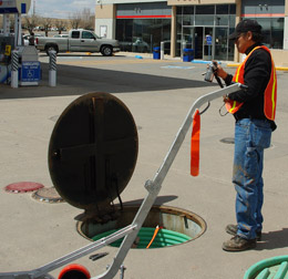 Newly re-credentialed Navajo-EPA agent inspects an underground storage tank