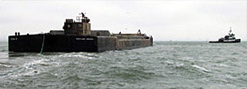 Barge being towed to an ocean disposal site