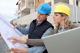 Construction workers discuss commercial water management, including commercial water conservation.